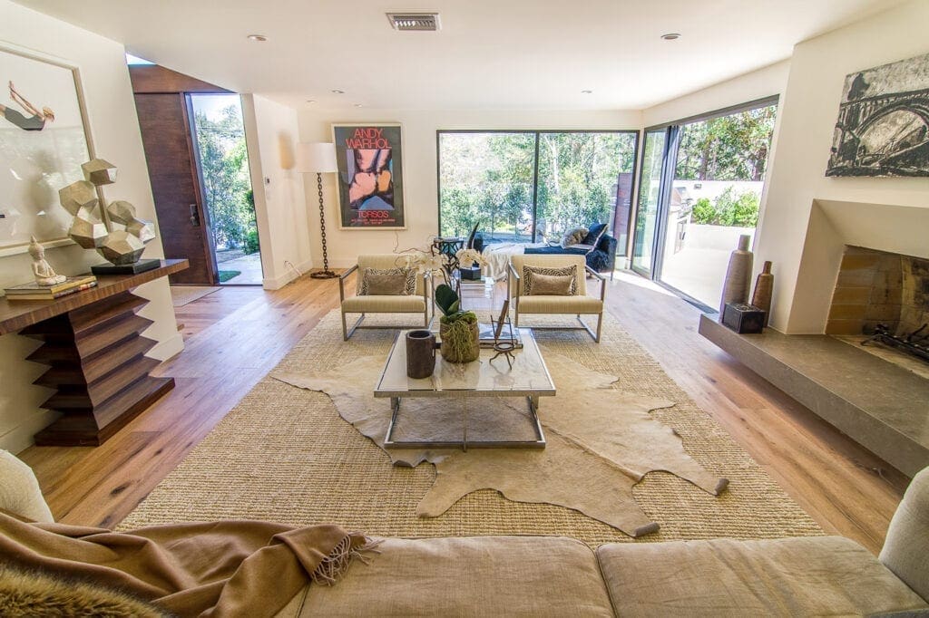 A living room with couches and tables in it