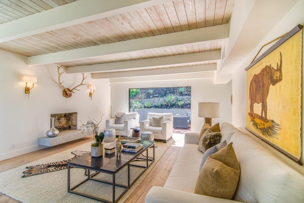A living room with couches and tables in it