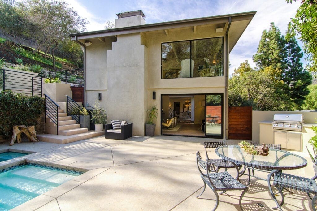 A large house with a pool and patio.