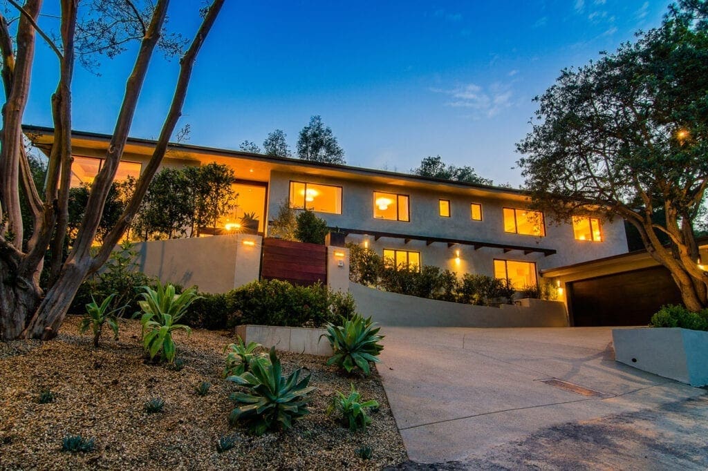 A large house with a lot of lights on it