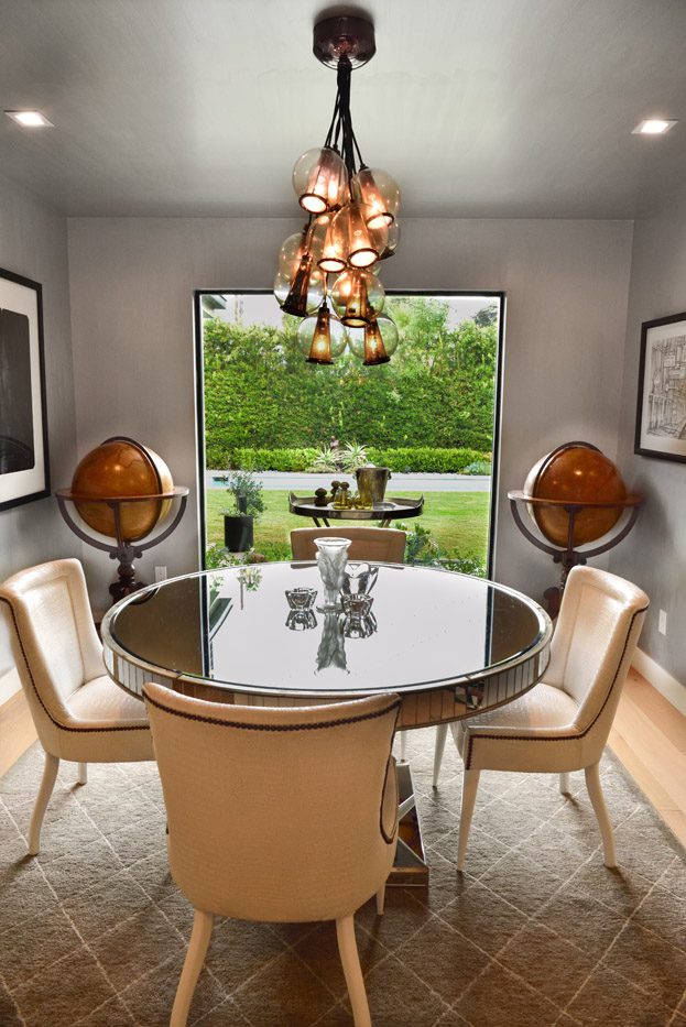 A dining room with chairs and a table