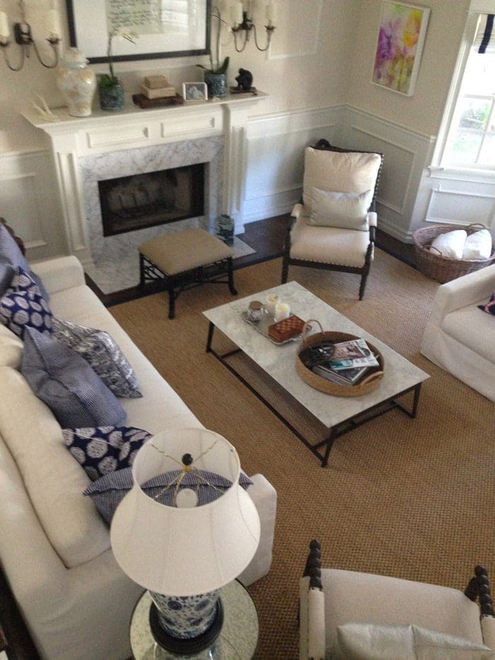 A living room with a fireplace and a couch