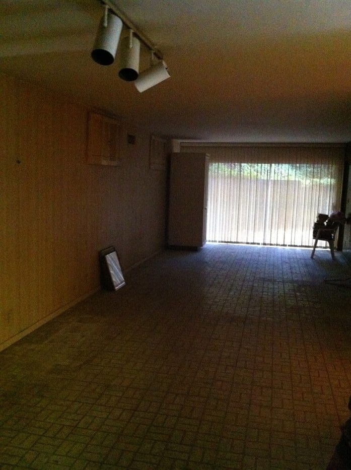 A room with a large window and a table
