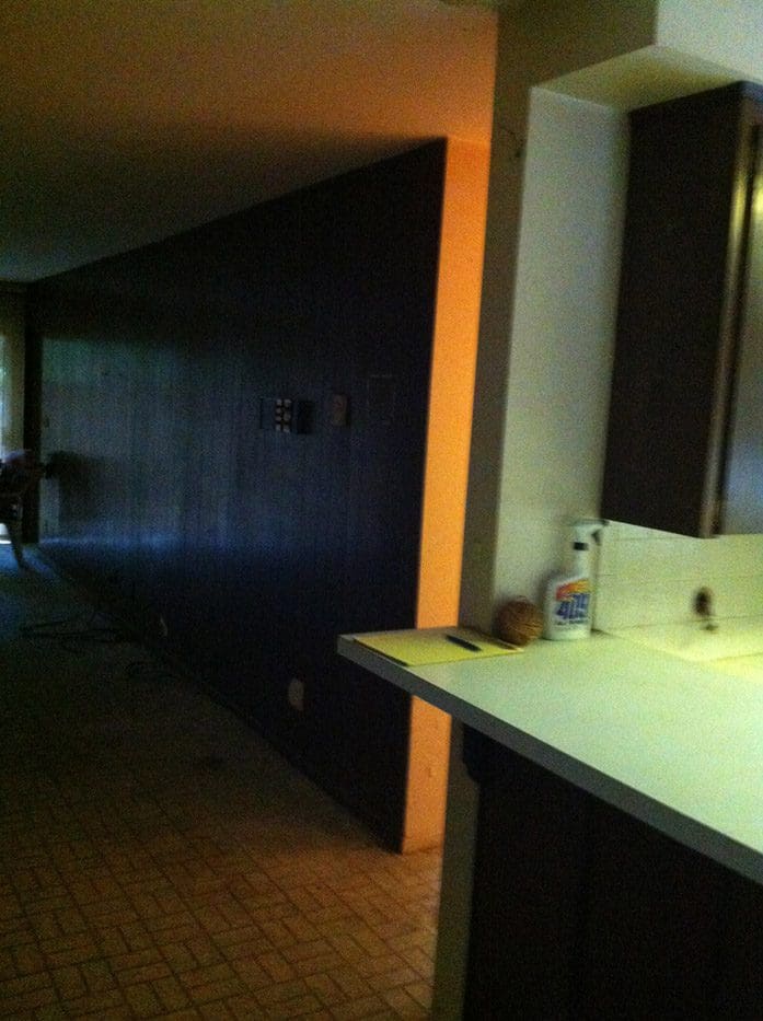 A bathroom with a sink and mirror in it