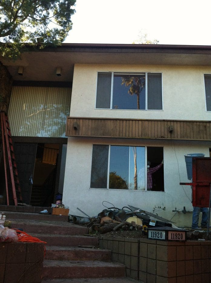 A house with some windows being renovated