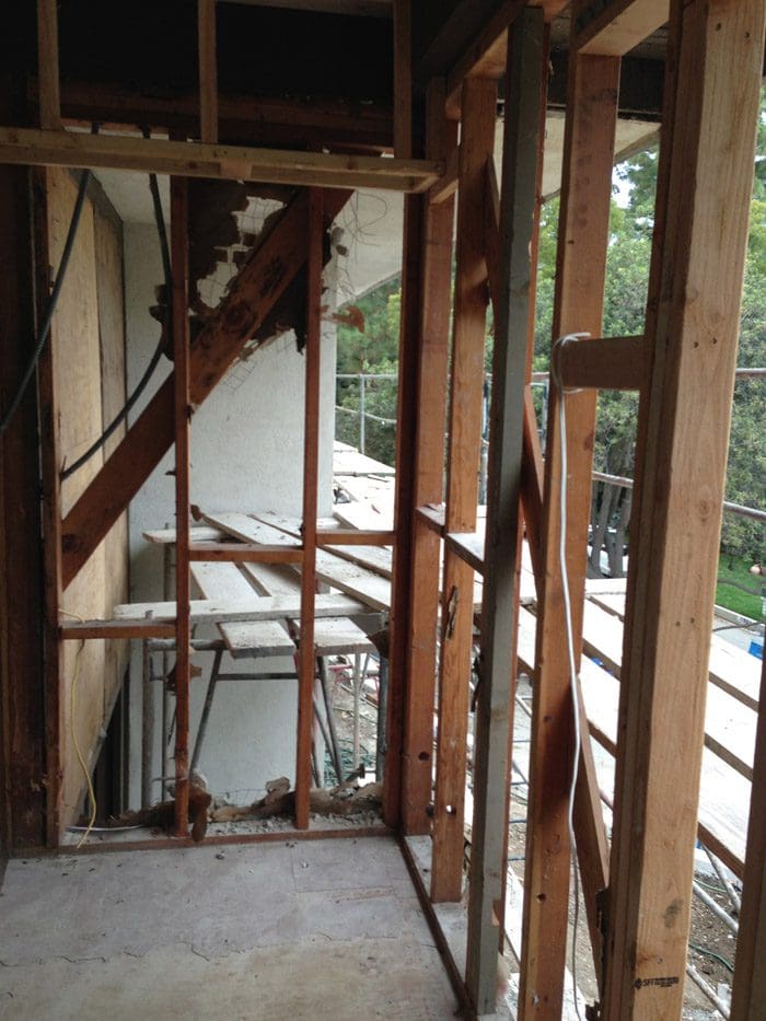 A room being built with wood framing and scaffolding.