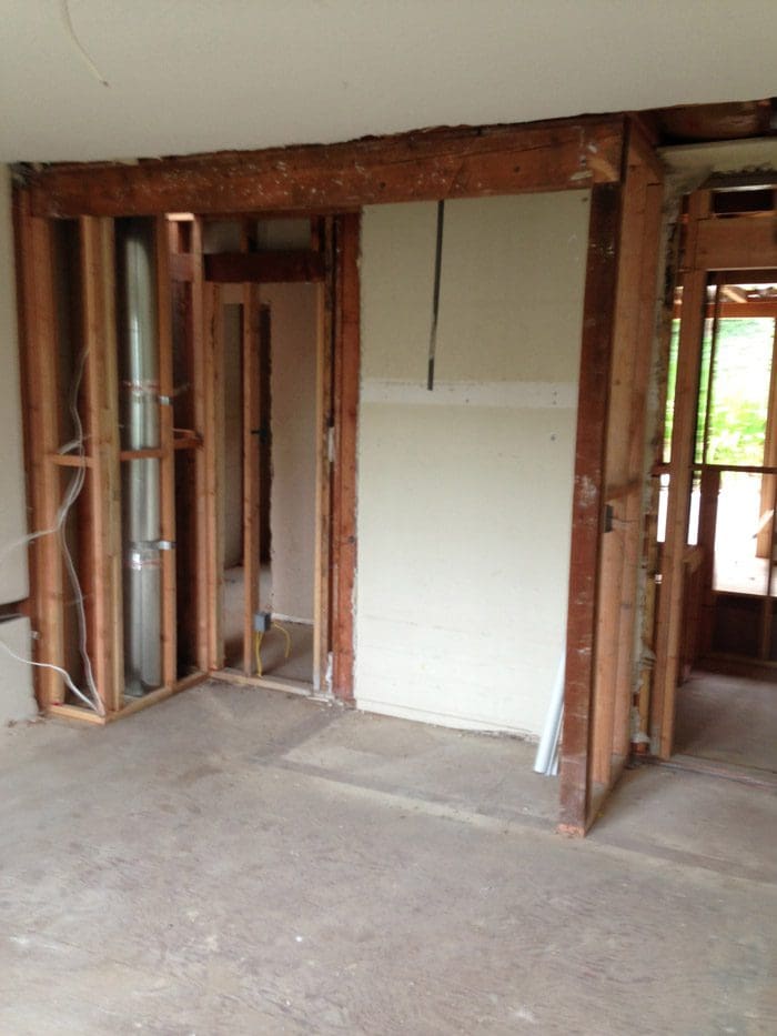 A room being remodeled with wood framing and doors.