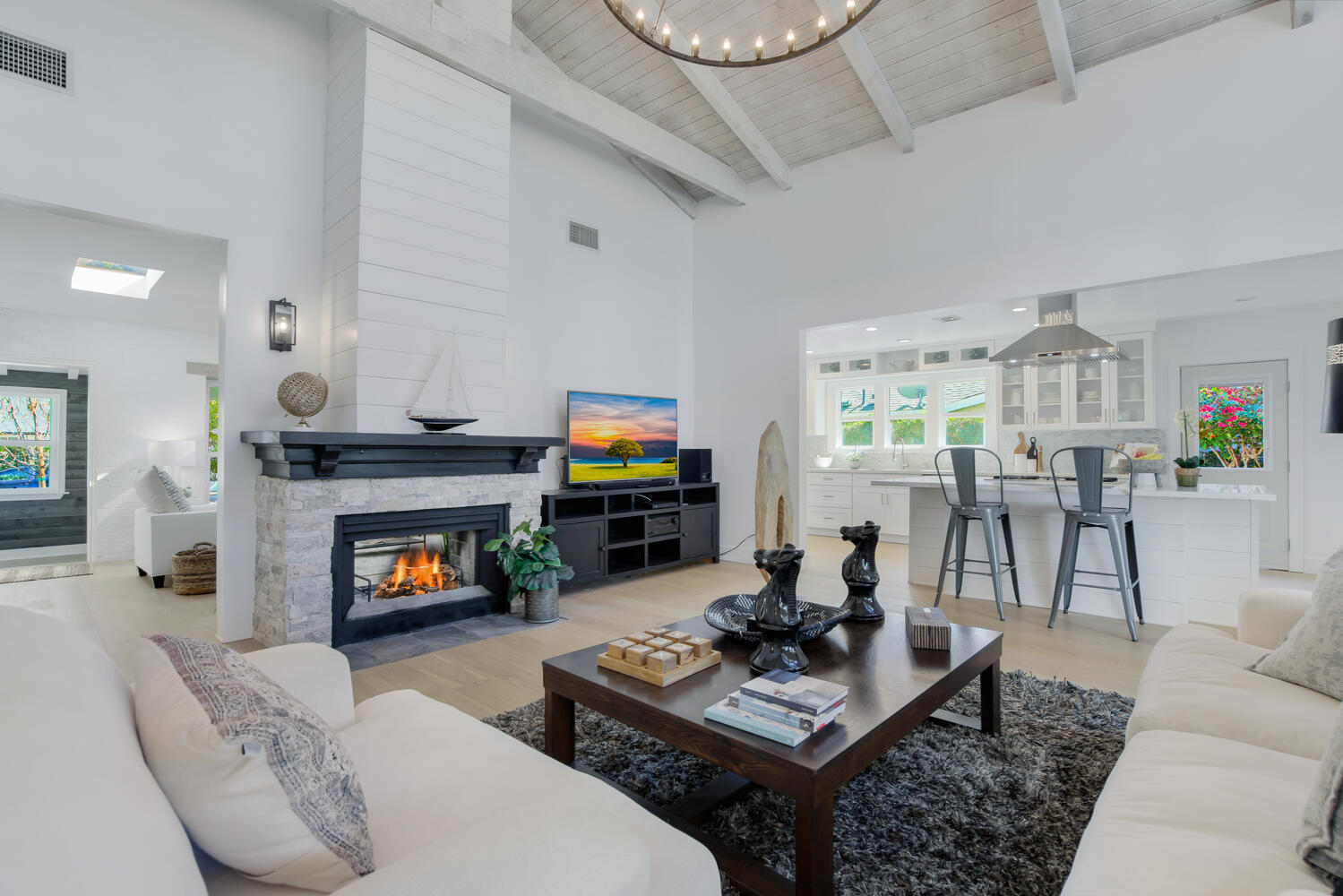 A living room with a fireplace and a tv.