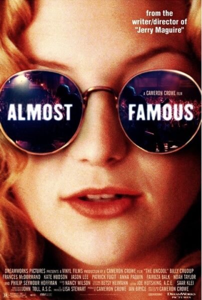 A woman with sunglasses on her head and the words " almost famous ".