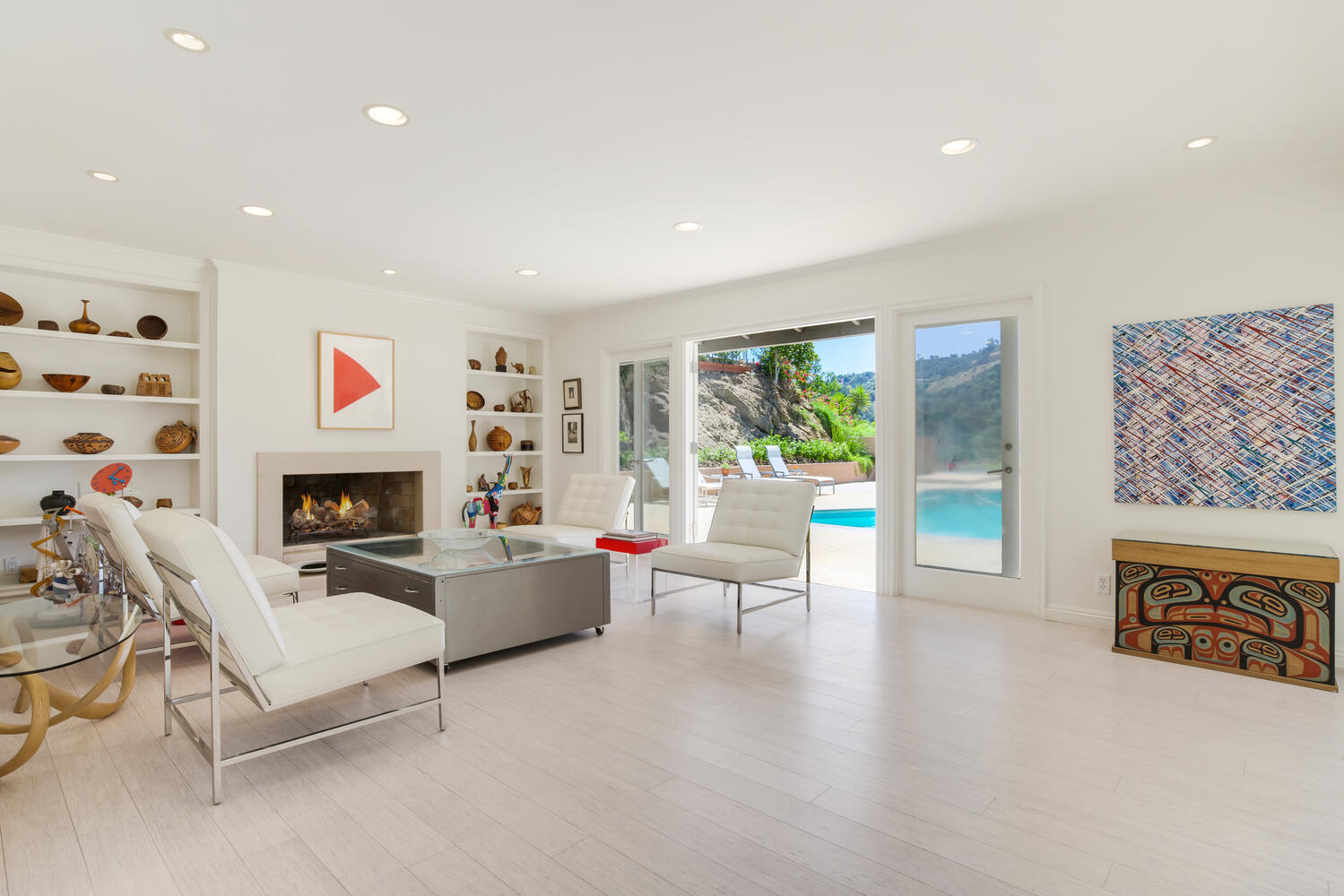 A living room with white walls and floors.