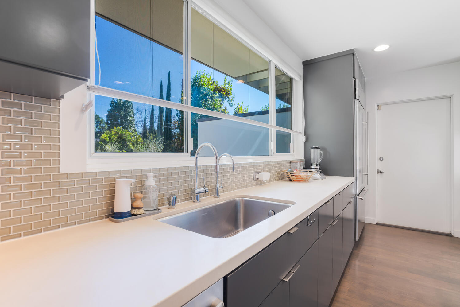 A kitchen with a sink and window in it