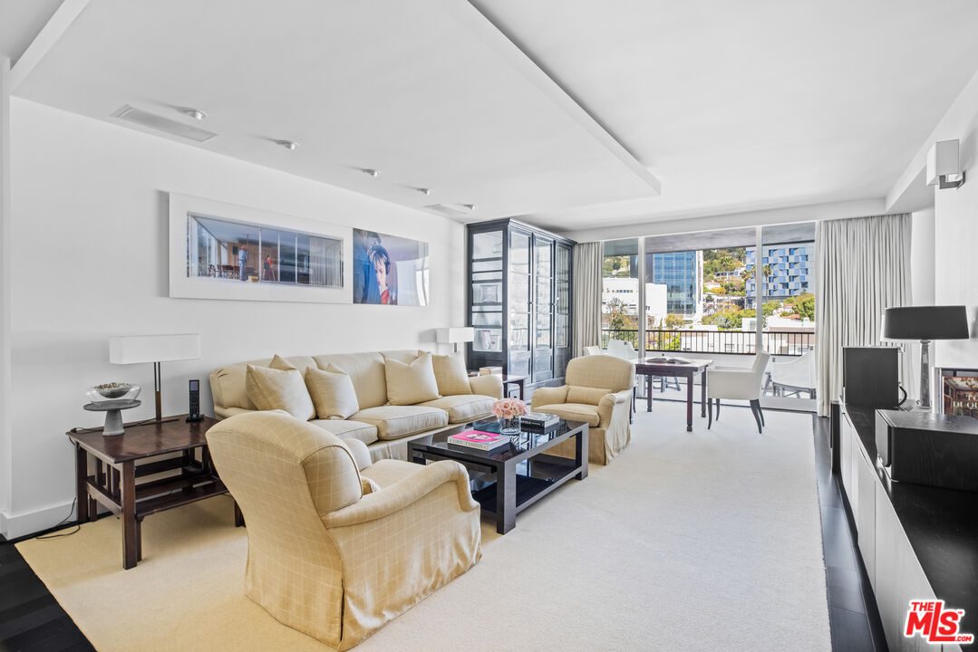 A living room with couches and tables in it