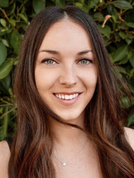 A woman with long hair and blue eyes.