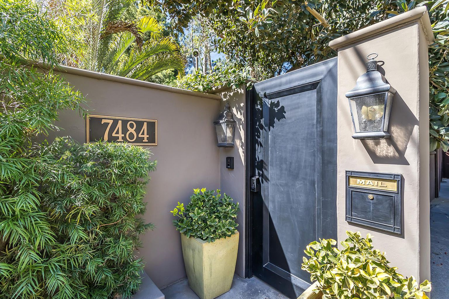 A door that is open to the side of a house.