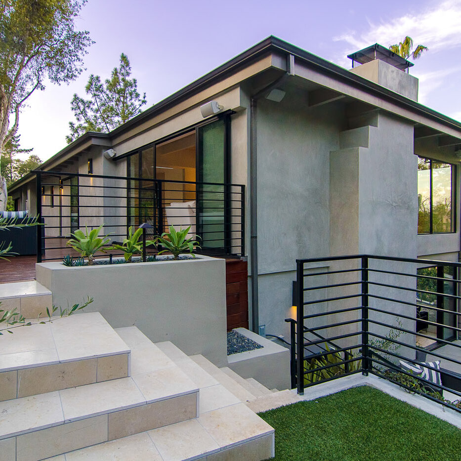 A house with steps leading to the front door.